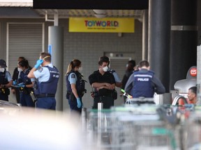 Police respond to the scene of an attack carried out by a man shot dead by police after he injured multiple people at a shopping mall in Auckland, New Zealand, Friday, Sept. 3, 2021.