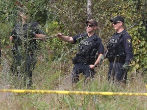 A passing cyclist spotted human remains in a wooded area on William Street West in Smiths Falls Monday afternoon.