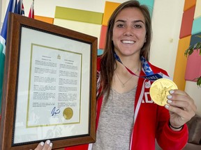 Olympic gold medallist Vanessa Gilles with the proclamation of Sept. 14, 2021 as Vanessa Gilles Day in Ottawa.