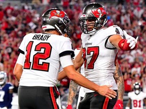 Tom Brady (left) and Rob Gronkowski of the Tampa Bay Buccaneers celebrate a touchdown during their team's 31-29 win over the Dallas Cowboys at Raymond James Stadium on Sept. 9, 2021 in Tampa, Fla.
