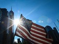 A U.S. flag flutters in the wind near the National 9/11 Memorial & Museum in New York City, Friday, Sept. 10, 2021.