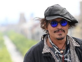 US actor Johnny Depp poses during the photocall of the film "Minamata" at the BCN Film Fest on April 16, 2021 in Barcelona.