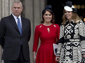 In this file photo taken on June 10, 2016, Prince Andrew (left) and his daughters Princess Eugenie of York (middle) and Princess Beatrice of York (right) leave after attending a national service of thanksgiving for the 90th birthday of Queen Elizabeth II at St Paul's Cathedral in London.