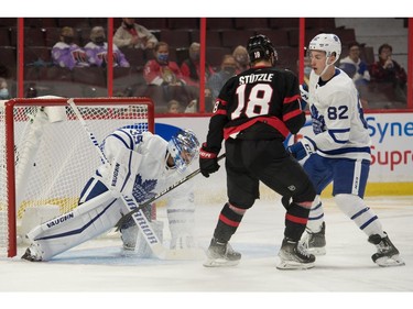 Toronto Maple Leafs goalie Petr Mrazek (35) covers the puck in front of Ottawa Senators left wing Tim Stuetzle (18) in the second period at the Canadian Tire Centre.