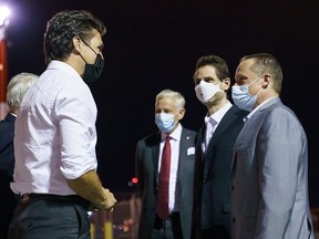 Prime Minister Justin Trudeau welcomes Michael Kovrig and Michael Spavor back to Canada at Calgary airport Saturday morning.