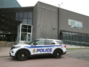 A Ottawa Police cruiser sits in front of St. Patrick High School in Ottawa Wednesday. Police are investigating a stabbing near or at the high school.
