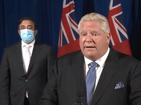 Premier Doug Ford announces plans for reopening. Kaleed Rasheed, left, the associate minister of digital government, was among the officials present.