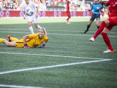 New Zealand's keeper, Erin Nayler, can only watch as Canada's Christine Sinclair scores in the first half.