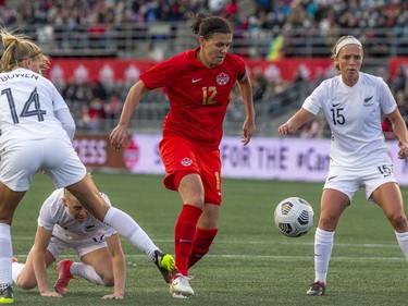 The Canadian national women's soccer team took on New Zealand in a friendly match at TD Place on Sunday at The Women's National Team Celebration Tour. Canada's #12 Christine Sinclair keeps the ball away from her opponents during the second half of the game.