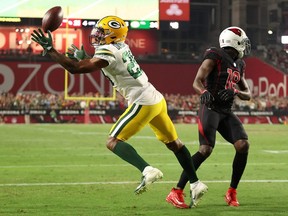 Rasul Douglas of the Green Bay Packers intercepts a pass intended for A.J. Green of the Arizona Cardinals during the fourth quarter of a game at State Farm Stadium on Oct. 28, 2021 in Glendale, Arizona. The Packers defeated the Cardinals 24-21.