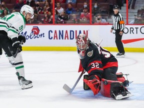 Filip Gustavsson #32 of the Ottawa Senators makes a pad save against Tyler Seguin #91 of the Dallas Stars at Canadian Tire Centre on October 17, 2021 in Ottawa, Ontario.