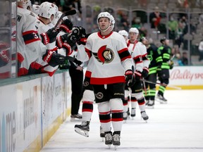 Josh Norris of the Senators celebrates with teammates after scoring a goal against the Stars in the first period of Friday's game in Dallas.