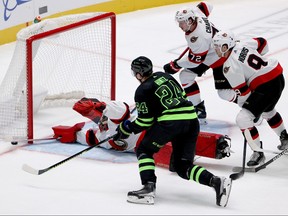 Filip Gustavsson #32 of the Ottawa Senators blocks a shot on goal against Joe Pavelski #16 of the Dallas Stars in third period at American Airlines Center on Friday night.