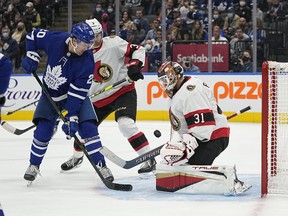Ottawa Senators goaltender Anton Forsberg makes a save on Toronto Maple Leafs forward Nick Ritchie.