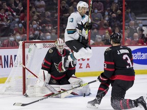 Sharks centre Nick Bonino jumps as he screens Senators goaltender Matt Murray during the second period of Thursday's game.