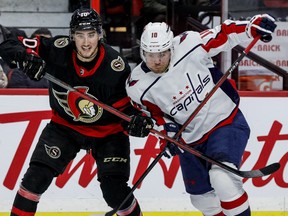 Ottawa Senators'  Alex Formenton (10) battles with Washington Capitals right winger Daniel Sprong at the Canadian Tire Centre on Monday night.
