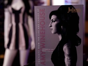 An auction catalog is displayed during the New York press and public exhibition of the "Property From The Life And Career Of Amy Winehouse" by Julien's Auctions in New York City, Monday, Oct. 11, 2021.