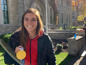 Ottawa’s Vanessa Gilles proudly shows off Olympic gold medal as part of Canadian women’s national team.