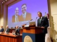Thomas Perlmann, Secretary of the Nobel Assembly and the Nobel Committee, announces the winners of the 2021 Nobel Prize in Physiology or Medicine David Julius and Ardem Patapoutian (seen on the screen) during a press conference at the Karolinska Institute in Stockholm, Sweden Oct. 4, 2021.