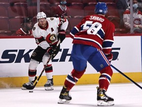 Ottawa Senators right wing Connor Brown plays the puck against Montreal Canadiens defenceman David Savard Thursday night in Montreal. USA TODAY SPORTS