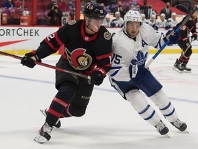 Ottawa Senators centre Shane Pinto battles with Toronto Maple Leafs centre Alexander Kerfoot at the Canadian Tire Centre last night.  
USA TODAY Sports