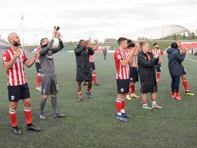Atletico Ottawa players salute the fans after their final home game of the 2021 season, a 1-1 draw against York United on Oct. 24, 2021.