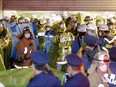 Rescue workers and police officers work at the site where a knife, arson and acid attack incident occurred on a train, at the Kokuryo station of the Keio Line train in Tokyo, Japan, Oct. 31, 2021 in this photo taken by Kyodo.