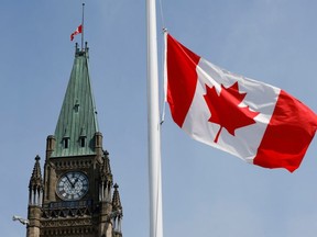 File photo of Canadian flag flying at half-mast on Parliament Hill in Ottawa, Ontario, Canada.