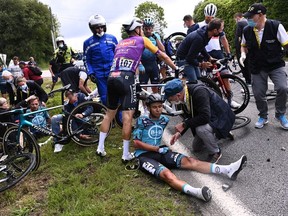 FILE PHOTO: Cycling - Tour de France - Stage 1 - Brest to Landerneau - France - June 26, 2021 B&B Hotels p/b KTM rider Cyril Lemoine of France receives medical attention.