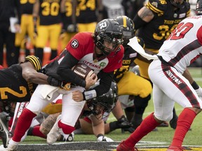 Redblacks quarterback Devlin (Duck) Hodges holds on for a short-yardage gain in the first half.