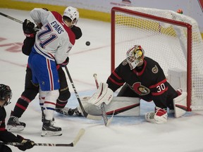 Ottawa Senators goalie Matt Murray (30) makes a save on a shot from Montreal Canadiens centre Jake Evans (71) in the third period at the Canadian Tire Centre.