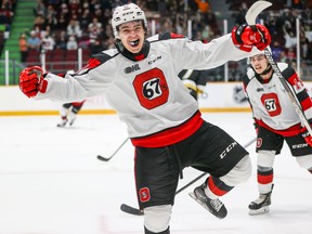 Brenden Sirizzotti celebrates his first goal of the season, and the go-ahead goal in the Ottawa 67's home opener 3-2 win over the Kingston Frontenac.