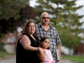OTTAWA - Oct 14, 2021 - Julie Wenge, her husband Christopher and daughter Brianna (9) outside Ottawa  home. Ten years ago, Wenge's infant son, Jordan, born three months premature, died in the first hours of his life.