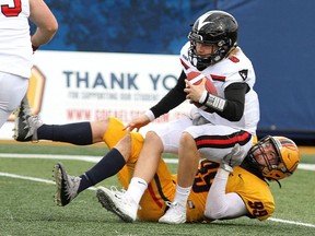 The Gaels' Anthony Federico sacks Ravens quarterback Reid Vankoughnett at Richardson Stadium in Kingston on Saturday.