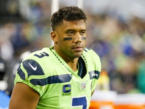 Seattle Seahawks quarterback Russell Wilson stands on the sideline during the fourth quarter against the Los Angeles Rams at Lumen Field.