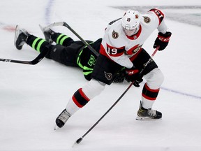 Drake Batherson #19 of the Ottawa Senators shoots the puck against Roope Hintz #24 of the Dallas Stars in the third period at American Airlines Center on October 29, 2021 in Dallas, Texas.