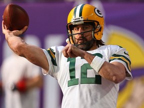 Aaron Rodgers of the Green Bay Packers warms up before the game against the Minnesota Vikings at U.S. Bank Stadium on November 21, 2021 in Minneapolis, Minnesota.