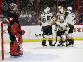 Senators goaltender Filip Gustavsson looks on as Vegas Golden Knights' Jonathan Marchessault (81) and his teammates celebrate his goal during second period NHL action at the Canadian Tire Centre on November 4,2021.