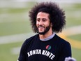 Colin Kaepernick looks on during his NFL workout held at Charles R Drew high school on November 16, 2019 in Riverdale, Georgia.