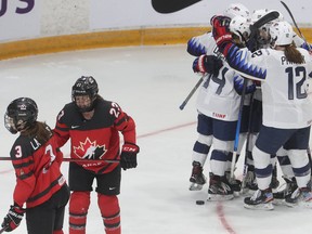 Canada's National Women's hockey team during second period action at TD Place in Ottawa Tuesday. United States celebrates their second period goal Tuesday.