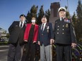 Veterans pose with Minister of National Defence Anita Anand after the Remembrance Day ceremony at Chris Vokes Memorial Park in Oakville, Ont., Sunday, Nov. 7, 2021.