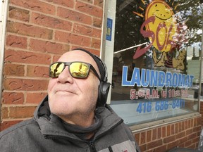 Steve Thamer, a voiceover narrator and prog-rock musician, sits outside on Queen St. E. in The Beach enjoying a sunny fall day on Friday, Nov. 5, 2021.