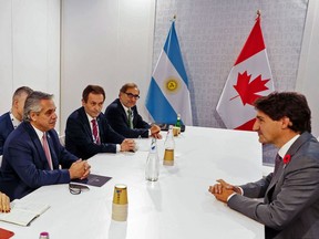 Handout picture released by the Argentine Presidency showing Argentine President Alberto Fernandez (3-L) meeting with the Prime Minister Justin Trudeau in the sidelines of the G20 of World Leaders Summit on Oct. 31, 2021 in Rome.