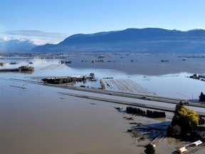 The Trans Canada highway remains partially submerged by flood water in Abbottsford, B.C., on Nov. 19, 2021.