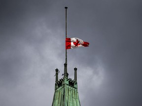 The Canadian flag at half mast above the Peace Tower on Parliament Hill on Monday, Sept. 13, 2021.