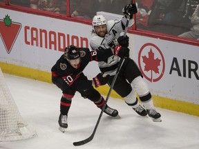 Ottawa Senators defenceman Lassi Thomson (60) battles with Los Angeles Kings left wing Alex Lafalio (19) in the third period at the Canadian Tire Centre, Nov. 11, 2021.