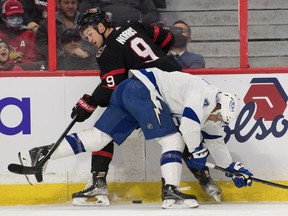 Senators centre Josh Norris (9) and Lightning winger Mathieu Joseph (7) battle for the puck in the first period of Saturday's game.