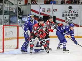 67's forwards Adam Varga and Chris Barlas create traffic in front of Steelheads goalie Joe Ranger during Friday's game in Ottawa. Also in the photo is Mississauga's Ole Bjorgvik-Holm (88).