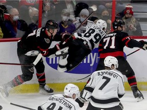 Senators caption Brady Tkachuk hits Kings player Rasmus Kupari during the first period of Thursday's game.