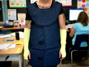 This is an educator at a school in southwestern Ontario who wears a padded vest and face protection to protect her from violent students.